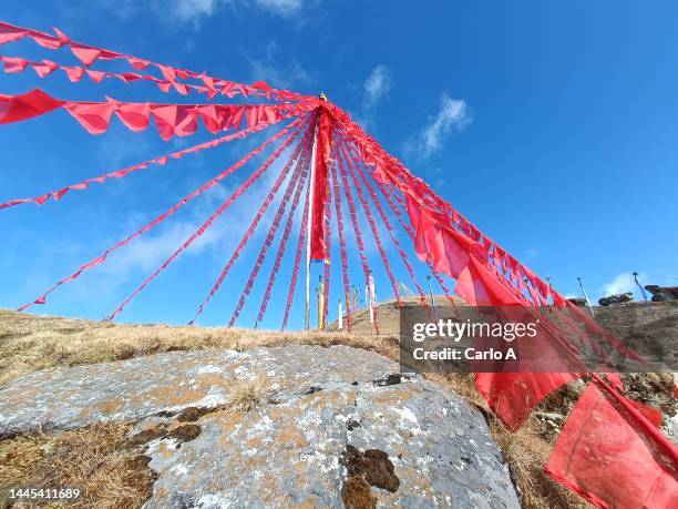 red flags of prayer in mountain landscape nepal - buddhist flag stock pictures, royalty-free photos & images