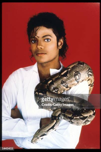 Entertainer Michael Jackson poses with his pet boa constrictor September 15, 1987 in the USA.