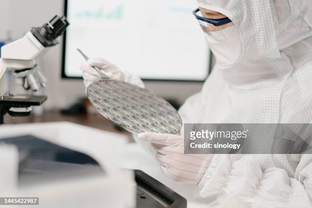 engineers are checking wafer chips in laboratory - süßgebäck teilchen stock-fotos und bilder