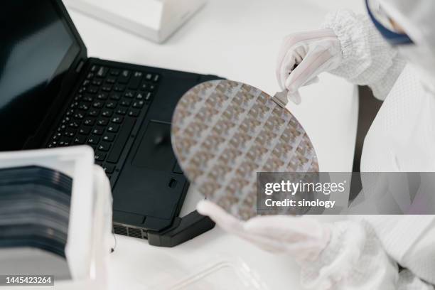 engineers are checking wafer chips in laboratory - süßgebäck teilchen stock-fotos und bilder