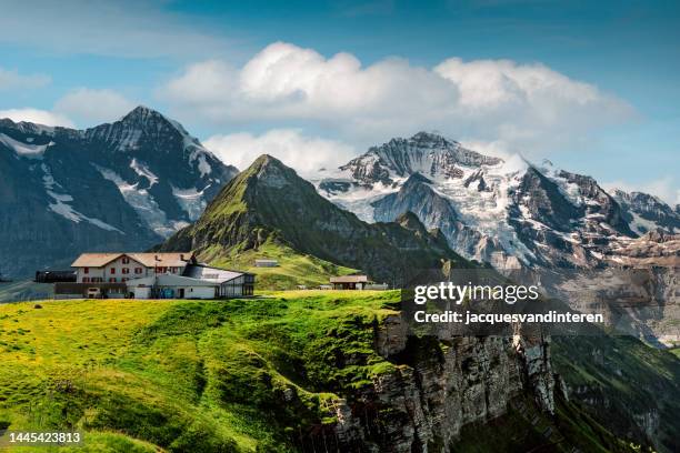 fascinating view of the mönch mountain (left) and jungfrau mountain (right) as seen from the männlichen mountain peak - mannlichen stock pictures, royalty-free photos & images