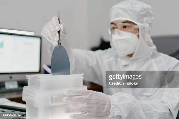 engineers are checking wafer chips in laboratory - süßgebäck teilchen stock-fotos und bilder