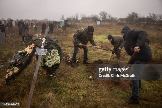 Local residents help police, forensic experts and war crimes prosecution teams to exhume the body of a 16-year-old girl that was buried by family...