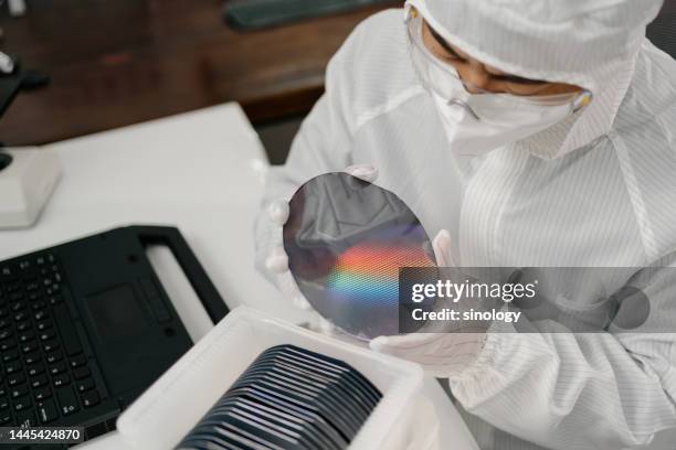 engineers are checking wafer chips in laboratory - süßgebäck teilchen stock-fotos und bilder