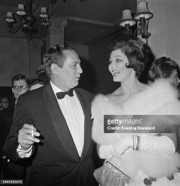 British-Australian actor Peter Finch and Miss Australia Rosemary Fenton at an event on February 13th, 1961.