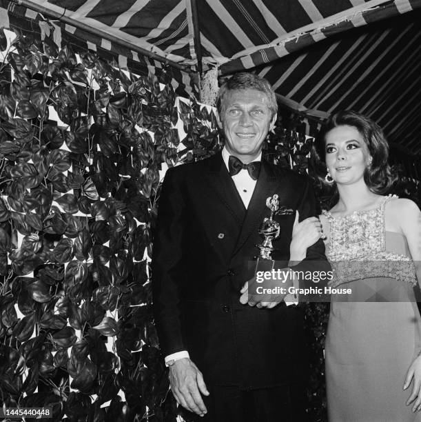 American actor Steve McQueen and American actress Natalie Wood attend the 24th Annual Golden Globe Awards at the Cocoanut Grove, a nightclub at the...