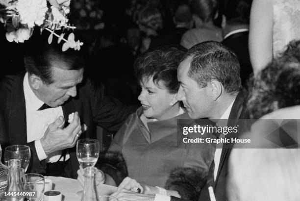 American actor Hayden Rorke , with American actress and singer Judy Garland and her husband, American actor Mark Herron attend the 37th Academy...