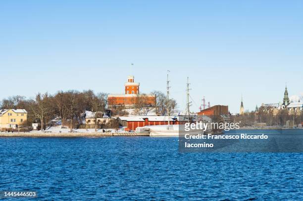 winter in stockholm, snowy cityscape from a ferry cruise - stockholm beach stock pictures, royalty-free photos & images