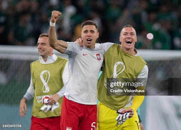 Jan Bednarek, Lukasz Skorupski and Kamil Grosicki of Poland celebrate following the FIFA World Cup Qatar 2022 Group C match between Poland and Saudi...