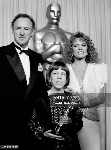Oscar Winner Linda Hunt is joined by presenters Gene Hackman and Dyan Cannon at the 56th Annual Academy Awards Show, April 9, 1984 in Los Angeles,...