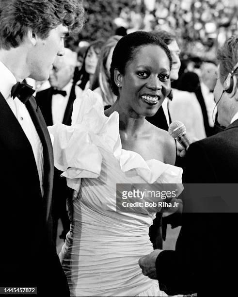 Alfre Woodard and Roderick Spenser arrives at the 56th Annual Academy Awards Show, April 9, 1984 in Los Angeles, California.