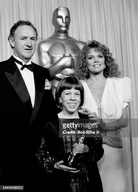 Oscar Winner Linda Hunt is joined by presenters Gene Hackman and Dyan Cannon at the 56th Annual Academy Awards Show, April 9, 1984 in Los Angeles,...