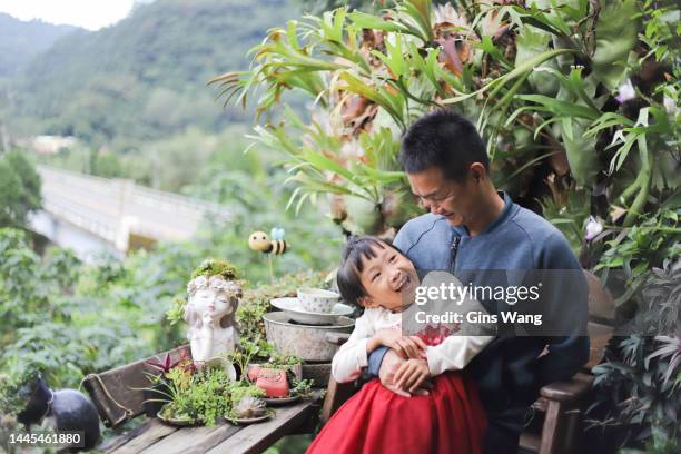 father and daughter. - elkhorn fern stock pictures, royalty-free photos & images