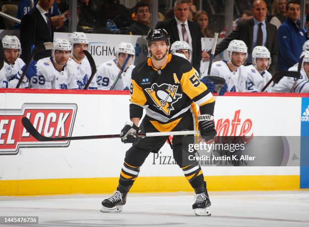 Kris Letang of the Pittsburgh Penguins in action against the Toronto Maple Leafs during the game at PPG PAINTS Arena on November 26, 2022 in...