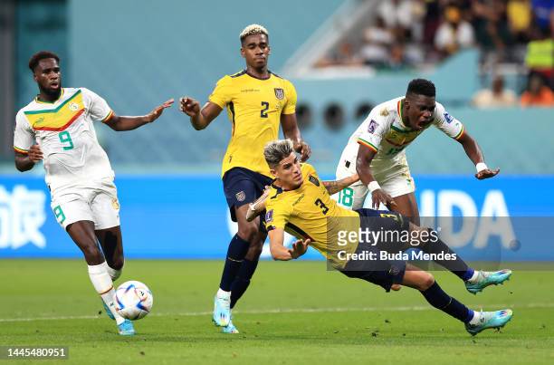 Ismaila Sarr of Senegal is brought down Piero Hincapie of Ecuador in the box resulting in a penalty during the FIFA World Cup Qatar 2022 Group A...