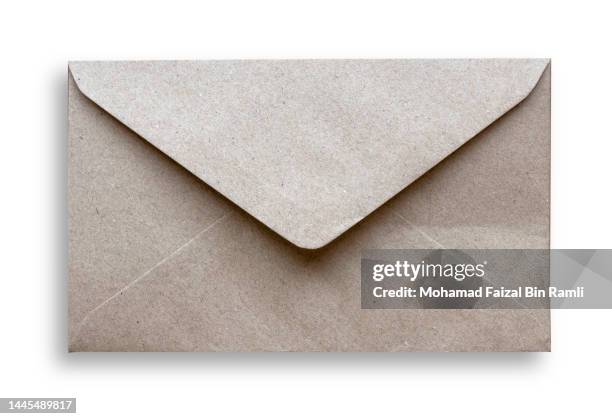 Brown craft closed envelope isolated on a white background. brown craft closed envelope isolated white