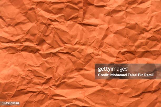 Orange crumpled paper for background. orange crumpled paper for background