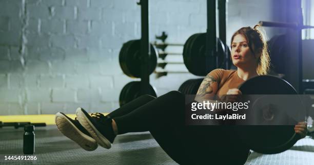 fitness, exercise and woman on at gym with weight for cross, workout and fit challenge on a floor. health, training and girl on a ground for weightlifting, health and mindset, control and endurance - womens hand weights stock pictures, royalty-free photos & images