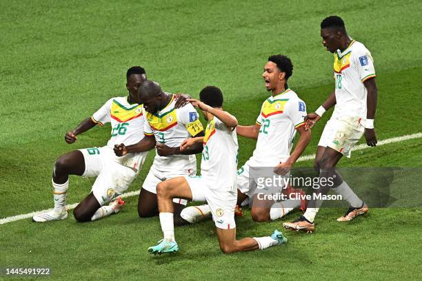 Kalidou Koulibaly of Senegal celebrates with teammates after scoring their team’s second goal during the FIFA World Cup Qatar 2022 Group A match...