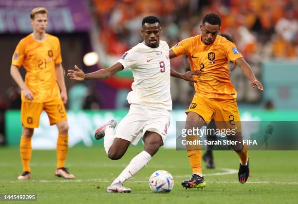 Jurrien Timber of Netherlands battles for possession with Mohammed Muntari of Qatar during the FIFA World Cup Qatar 2022 Group A match between...
