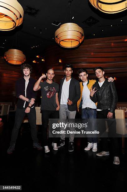 Jay McGuiness, Max George, Siva Kaneswaran, Nathan Sykes and Tom Parker of the musical group The Wanted portraits at Stack restaurant at the Mirage...