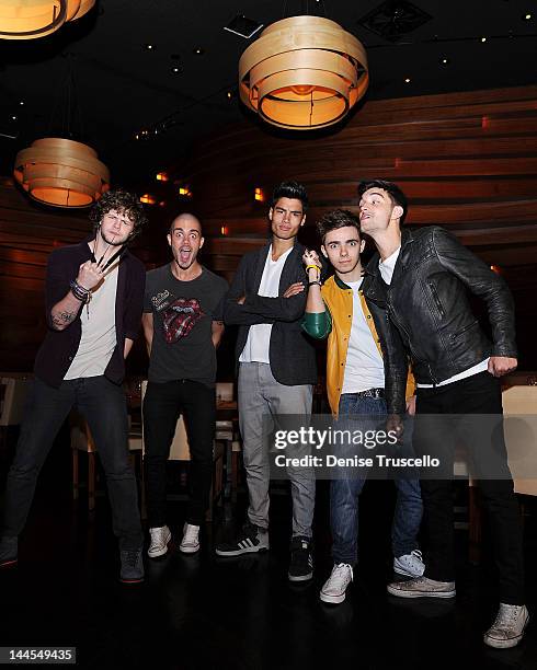 Jay McGuiness, Max George, Siva Kaneswaran, Nathan Sykes and Tom Parker of the musical group The Wanted portraits at Stack restaurant at the Mirage...