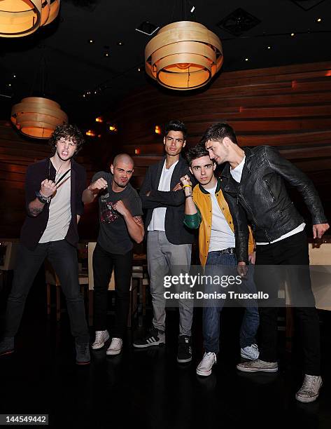 Jay McGuiness, Max George, Siva Kaneswaran, Nathan Sykes and Tom Parker of the musical group The Wanted portraits at Stack restaurant at the Mirage...