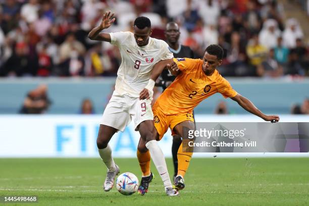 Mohammed Muntari of Qatar controls the ball under pressure of Jurrien Timber of Netherlands during the FIFA World Cup Qatar 2022 Group A match...