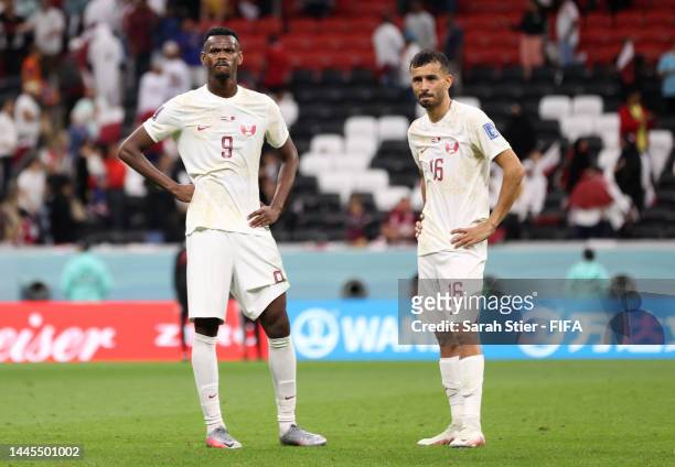 Mohammed Muntari and Boualem Khoukhi of Qatar react after the 0-2 loss during the FIFA World Cup Qatar 2022 Group A match between Netherlands and...