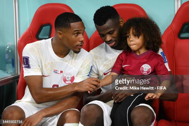 Pedro Miguel and Mohammed Muntari of Qatar look dejected following their side's defeat in the FIFA World Cup Qatar 2022 Group A match between...