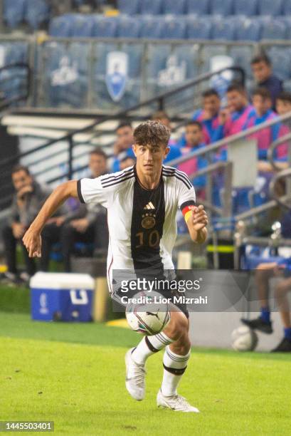 Tom Bischof of Germany runs with the ball during the U18 match with Israel at the Winter Tournament at Hamoshava Stadium on November 29, 2022 in...