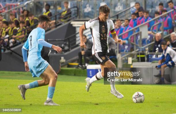 Tom Bischof of Germany in action with Amit Lemkin of Israel during the Winter Tournament 2022 match between Israel U18 and Germany U18 at Hamoshava...