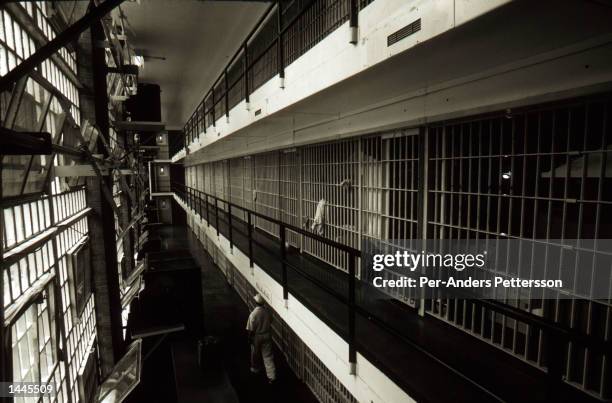 Prison cells line a hall at the Ellis death row unit April 16, 1997 in Huntsville Prison in Huntsville, Texas. The state has about 450 prisoners on...