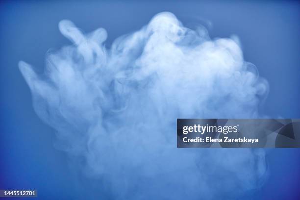 steam on a blue background - water vapor stock pictures, royalty-free photos & images