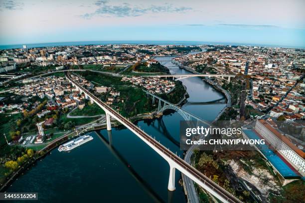 porto, portugal. aerial view of the old city and promenade of the douro river. view of the city and bridges over the river - porto district portugal stockfoto's en -beelden