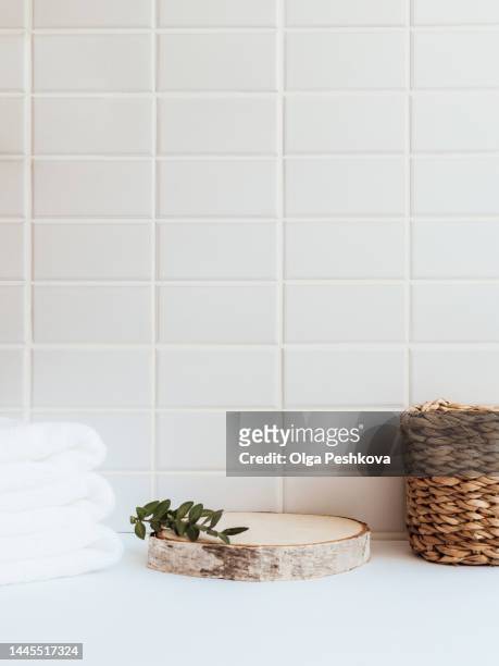wood round podium for bathing products in bathroom, spa shampoo, shower gel, liquid soap. - clean wood table stock pictures, royalty-free photos & images
