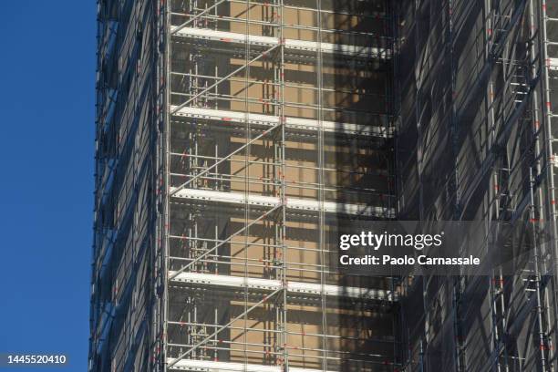 apartment building with scaffolding for renovation - ponteggi foto e immagini stock