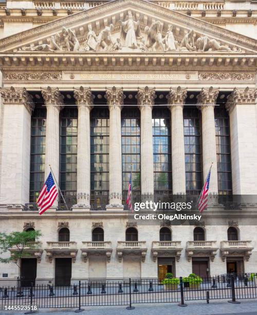 new york stock exchange as seen from wall street, lower manhattan financial district, ny, usa. - nyse facade stock pictures, royalty-free photos & images