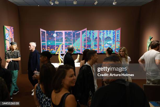 Guests view art on display during Art Basel Miami Beach VIP Preview 2022 at Miami Beach Convention Center on November 29, 2022 in Miami Beach,...