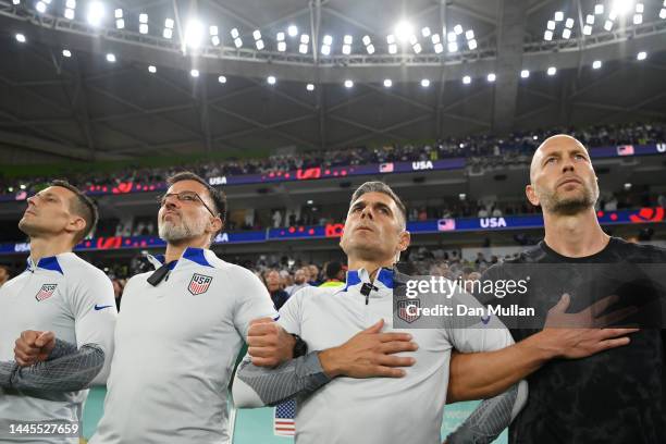 Gregg Berhalter, Head Coach of United States, sings their national anthem with staff prior to the FIFA World Cup Qatar 2022 Group B match between IR...