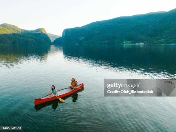 aerial view of man and woman canoeing on the lake in norway - rowboat bildbanksfoton och bilder