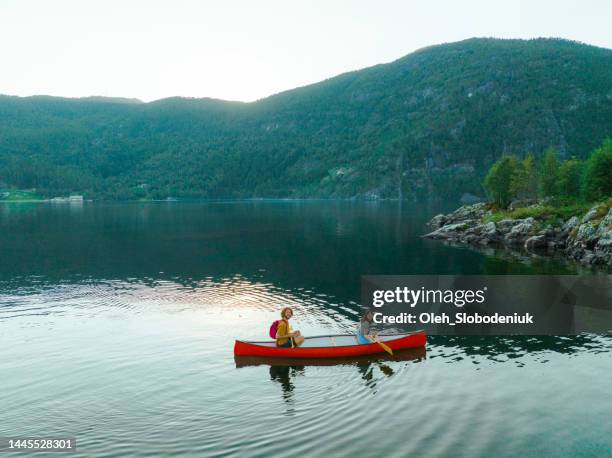 aerial view of man and woman canoeing on the lake in norway - norway womens training session stock pictures, royalty-free photos & images