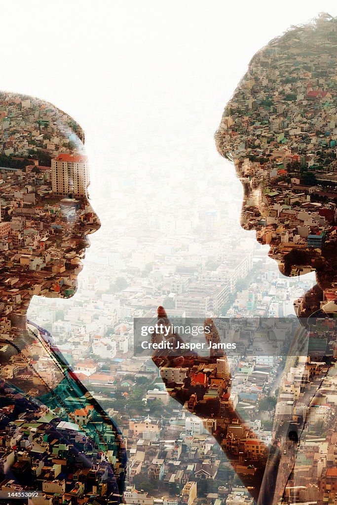 Double exposure of man,woman and cityscape