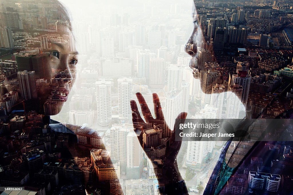 Double exposure of two woman and cityscape