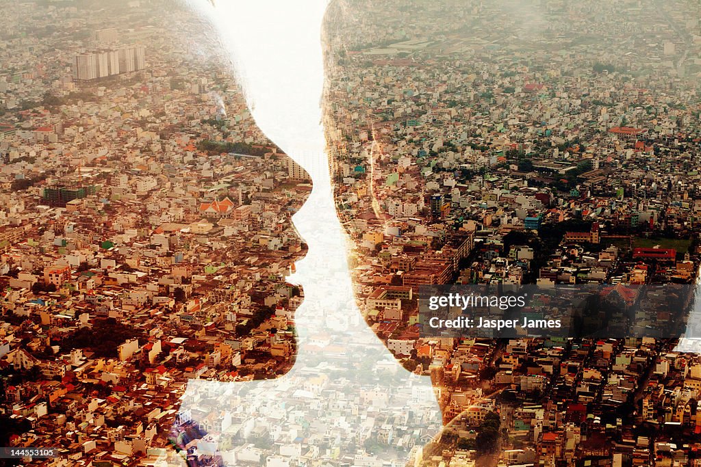 Double exposure of a woman talking to a man