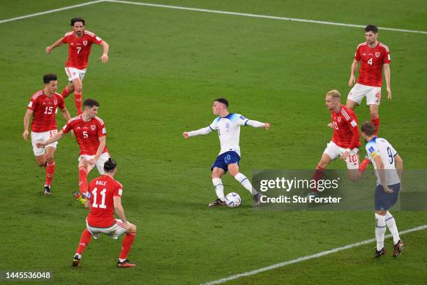 Phil Foden of England shoots at goal during the FIFA World Cup Qatar 2022 Group B match between Wales and England at Ahmad Bin Ali Stadium on...