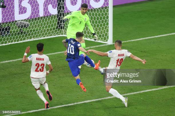 Christian Pulisic of United States scores their team's first goal during the FIFA World Cup Qatar 2022 Group B match between IR Iran and USA at Al...