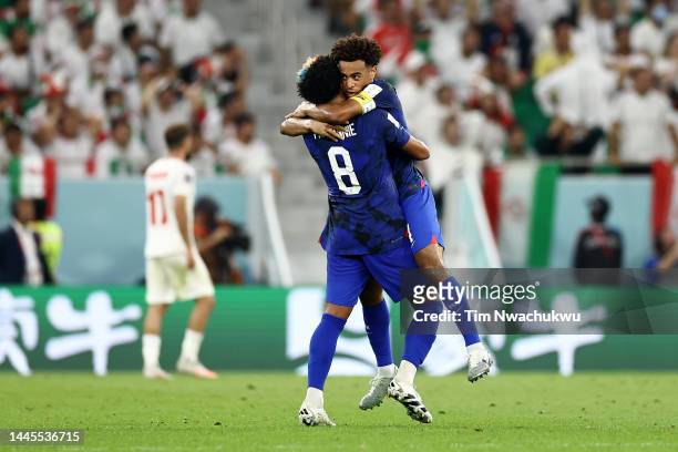 Weston McKennie and Tyler Adams of United States celebrate after Christian Pulisic of United States scored their sides first goal during the FIFA...