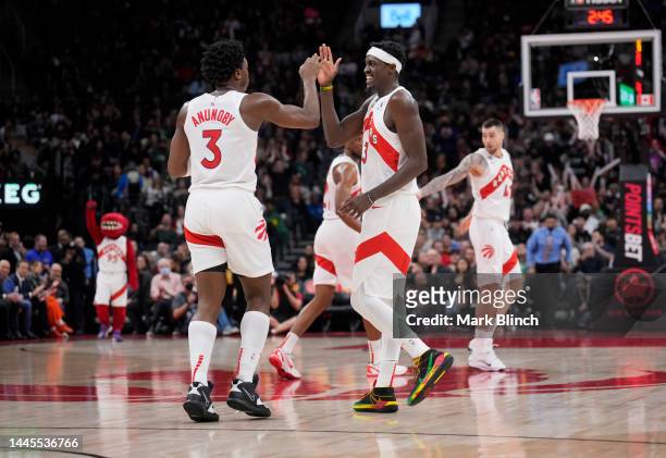 Pascal Siakam and O.G. Anunoby of the Toronto Raptors celebrate against the Cleveland Cavaliers during the second half of their basketball game at...