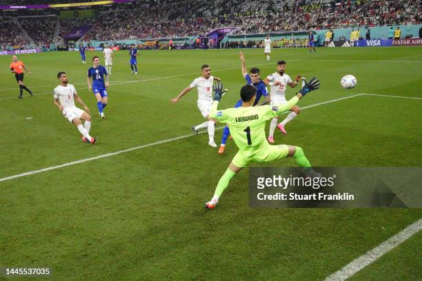 Christian Pulisic of United States scores their team's first goal past Alireza Beiranvand of IR Iran during the FIFA World Cup Qatar 2022 Group B...